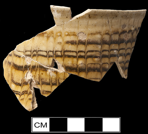North Midlands slip decorated handled cup decorated with trailed and combed decoration.  Rim diameter: 3.50&rdquo;; Object  ID:  2647. Learn more about this object at: http://mountvernonmidden.org/default.html.